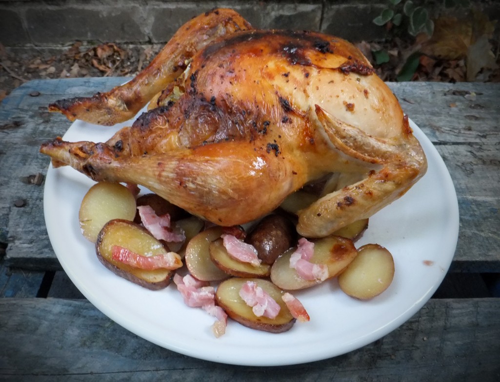 Roast chicken with bacon and potatoes