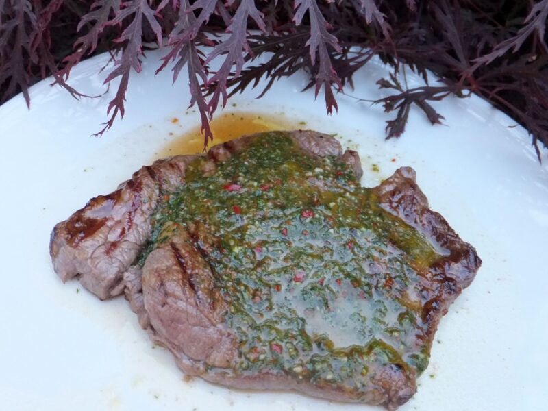 Steak with basil sauce