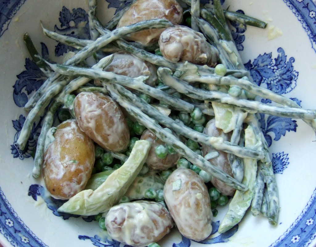 New potato salad with green peas, beans and avocado