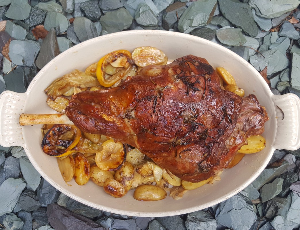 Zesty roast lamb with artichokes and new potatoes