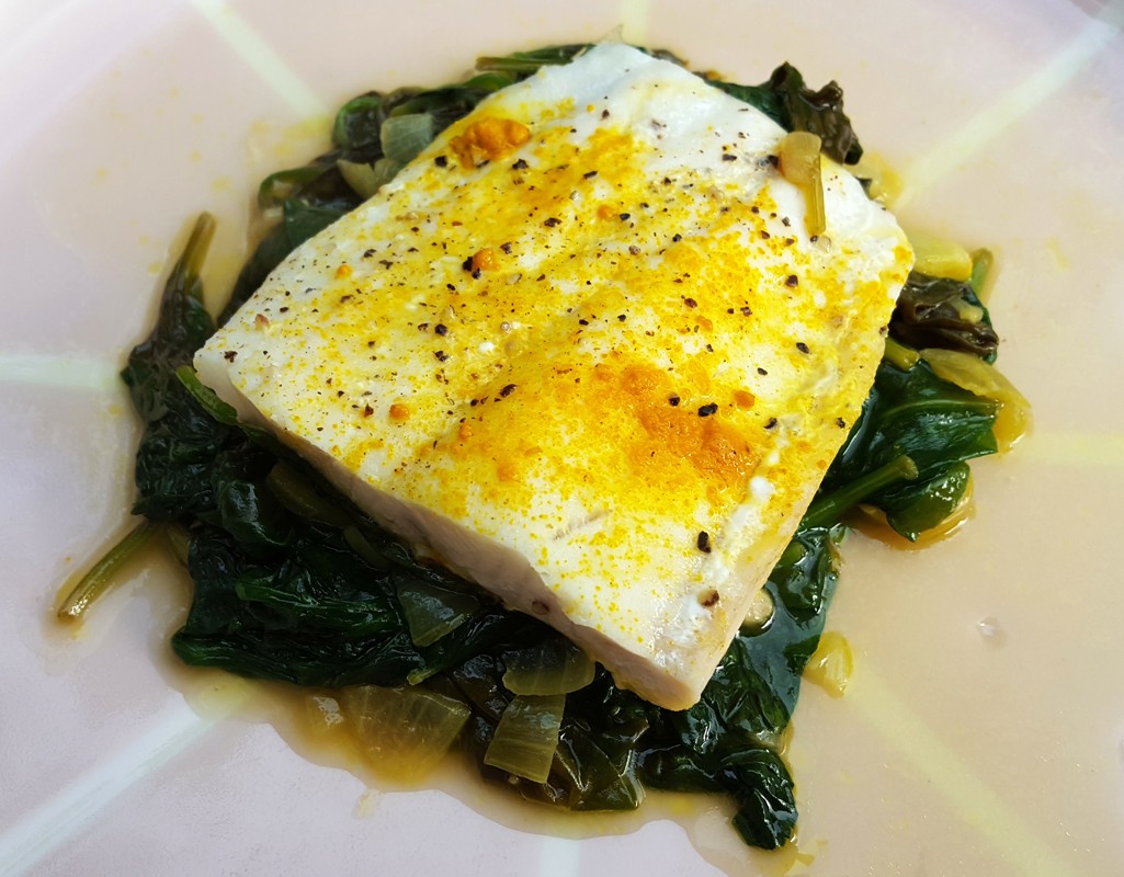 Braised haddock with spiced spinach