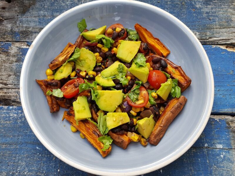 Sweet potato chips with spiced beans, corn and avocado