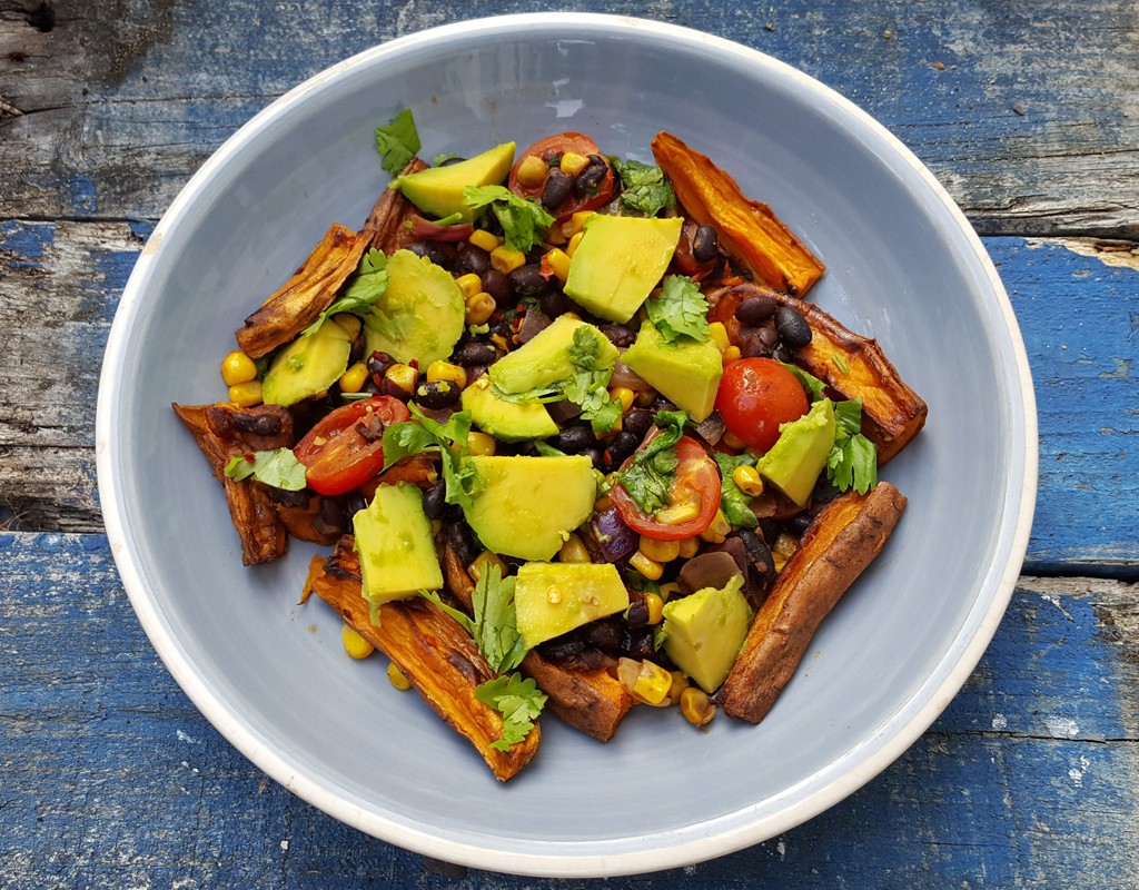 Sweet potato chips with spiced beans, corn and avocado