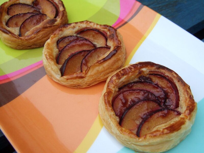 Puff-pastry plum and frangipane tarts