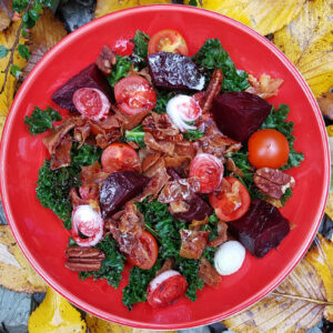 Kale with beetroot and parma ham