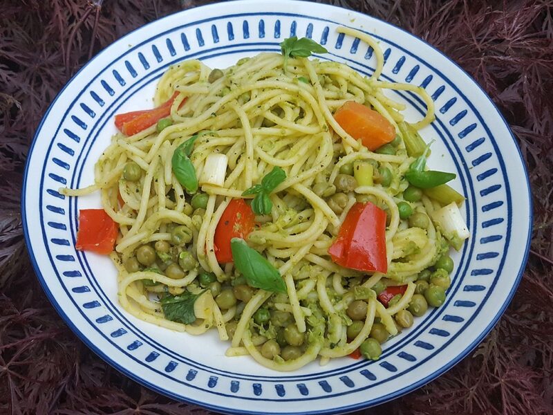 Pea pesto pasta with sautéed vegetables