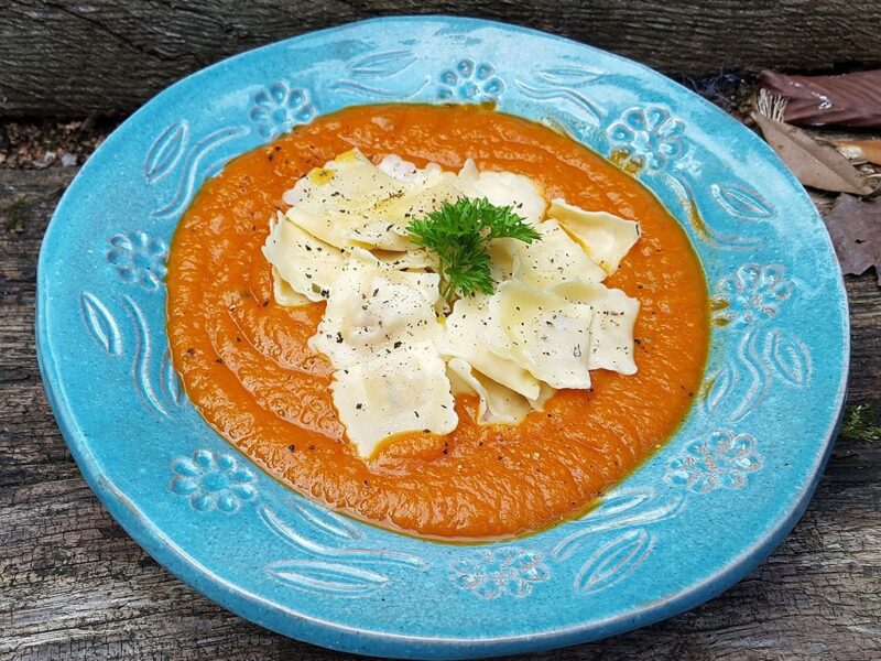 Pumpkin ravioli in squash and tomato sauce