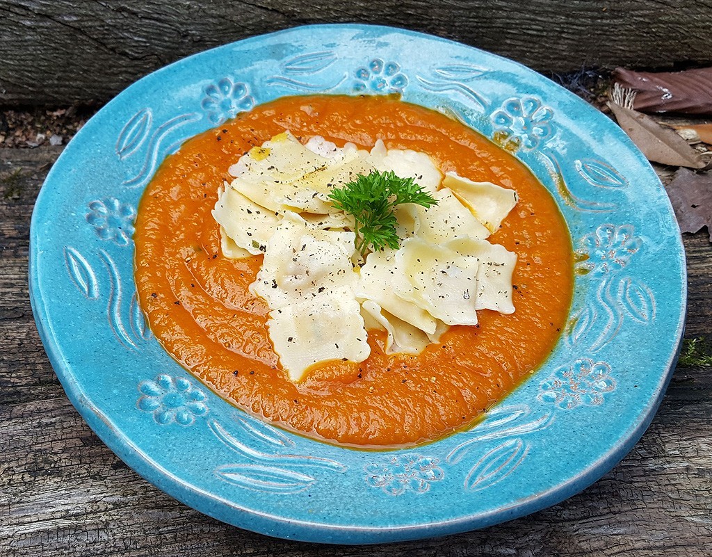 Pumpkin ravioli in squash and tomato sauce