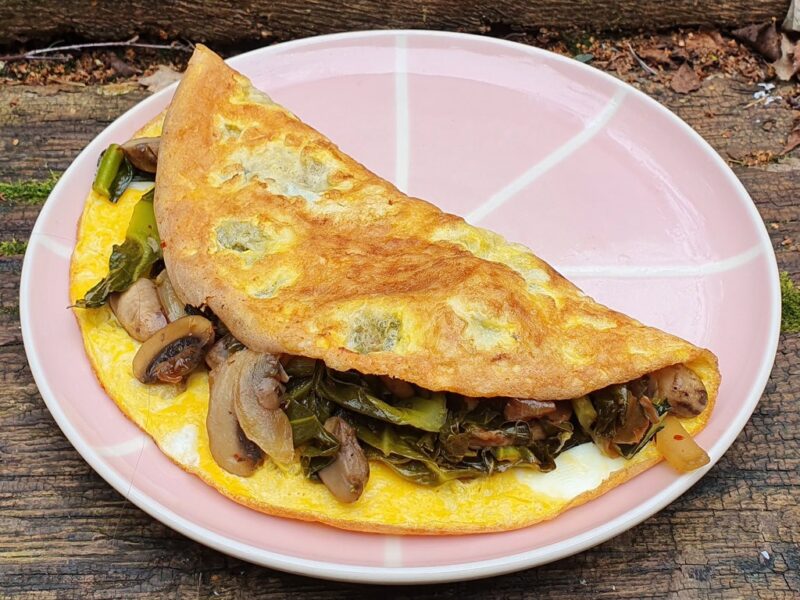 Mushroom and spring greens omelette