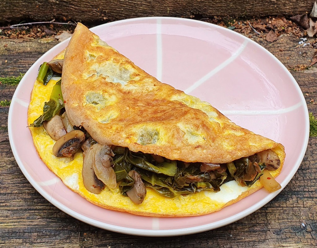 Mushroom and spring greens omelette