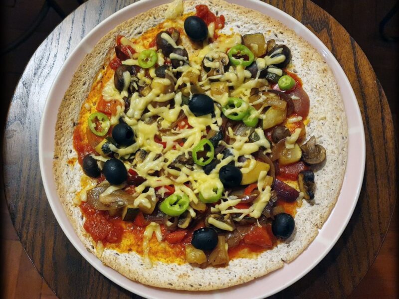 Tortilla pizza with caramelised onion, mushroom & courgette