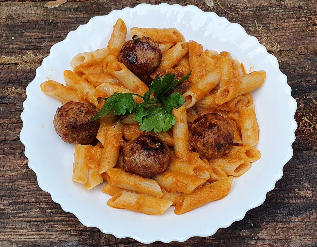 Pasta with vegan meatballs and sweet potato sauce