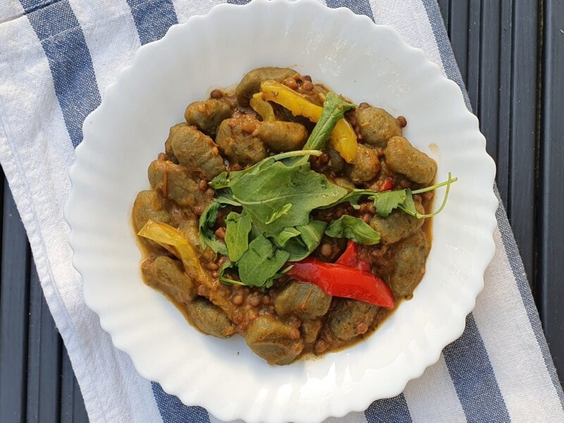 Gnocchi with lentils in roasted tomato and pepper sauce