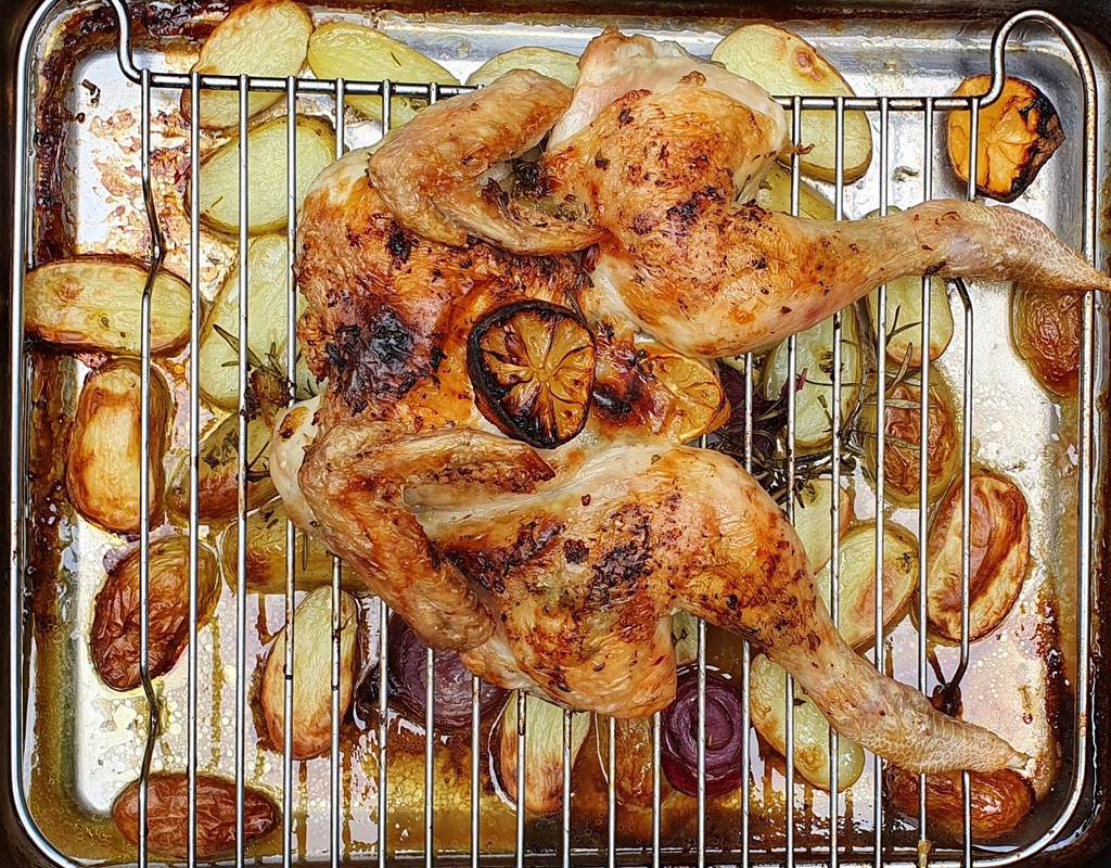 Butterflied roast chicken with potatoes