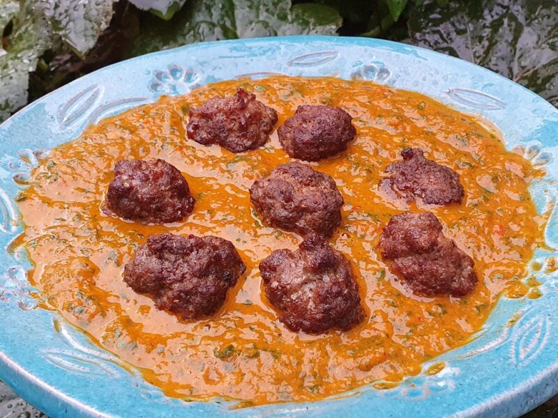 Spiced meatballs in baked tomato and spinach sauce