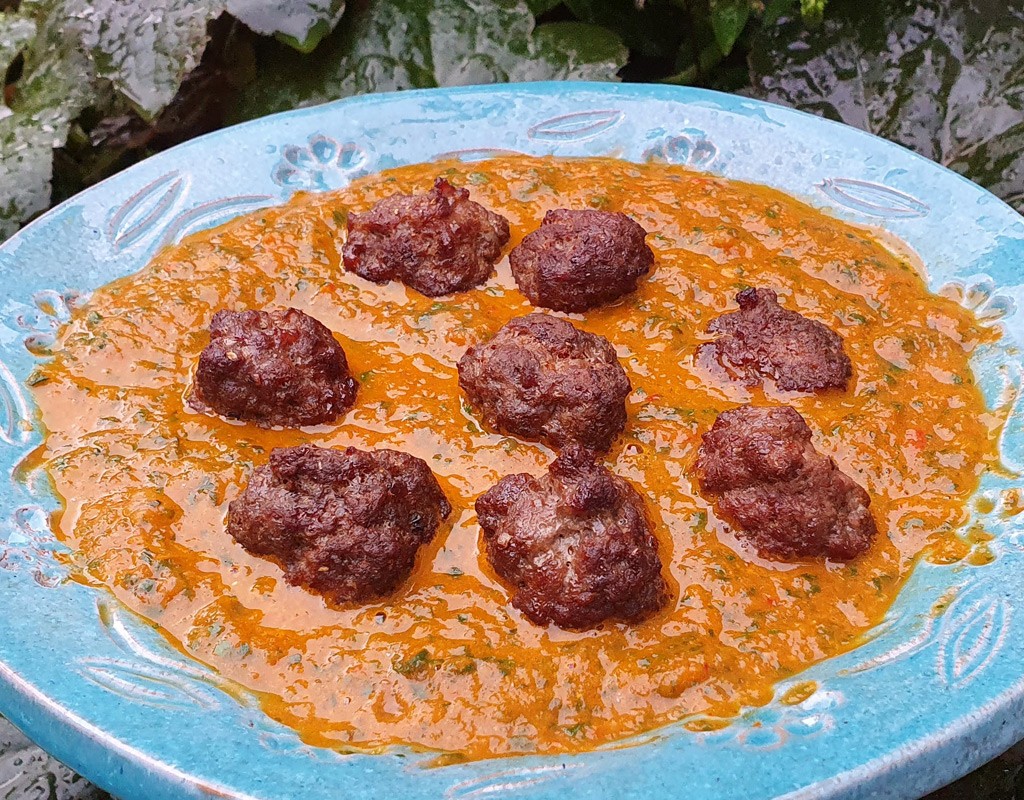 Spiced meatballs in baked tomato and spinach sauce