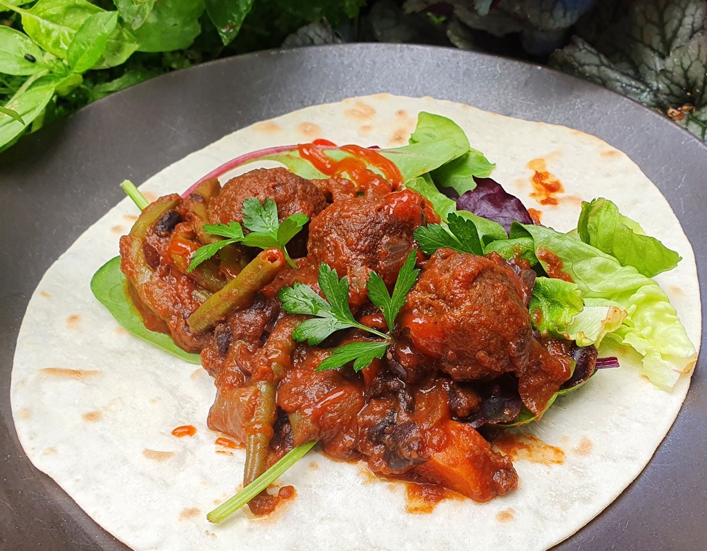 Vegan meatball and black bean burritos