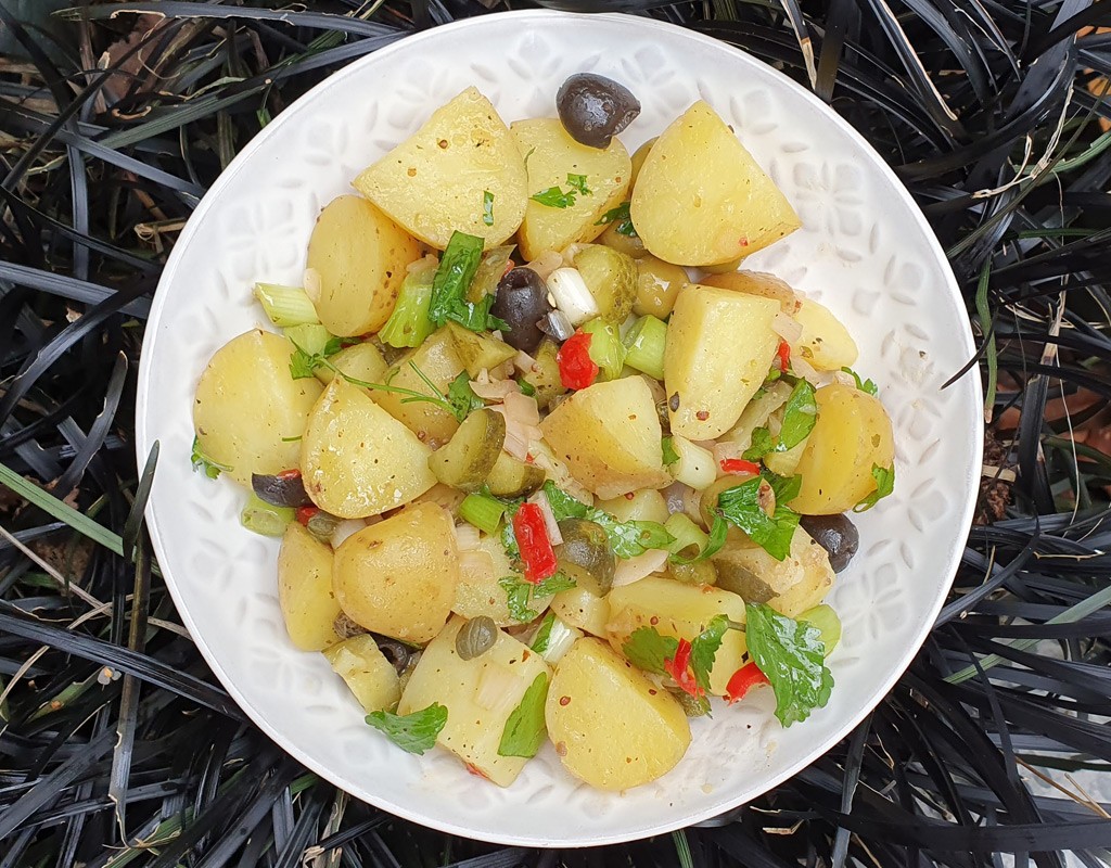 Potato salad with olives and gherkins