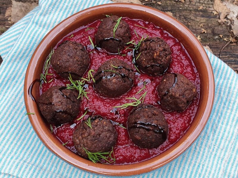 Vegan meatballs in baked beetroot & red pepper sauce