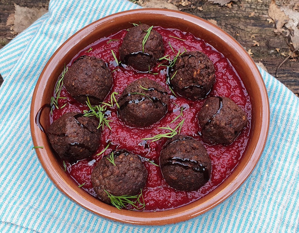 Vegan meatballs in baked beetroot & red pepper sauce