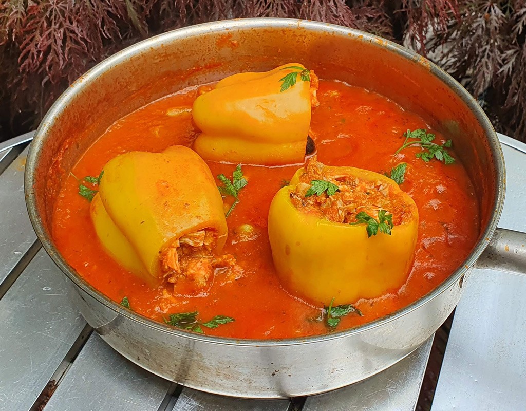 Chicken stuffed peppers in tomato sauce