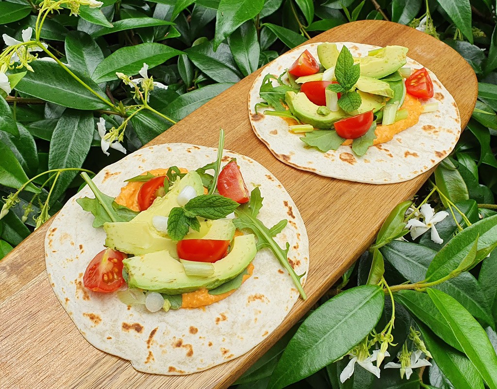 Avocado and roasted pepper hummus tacos