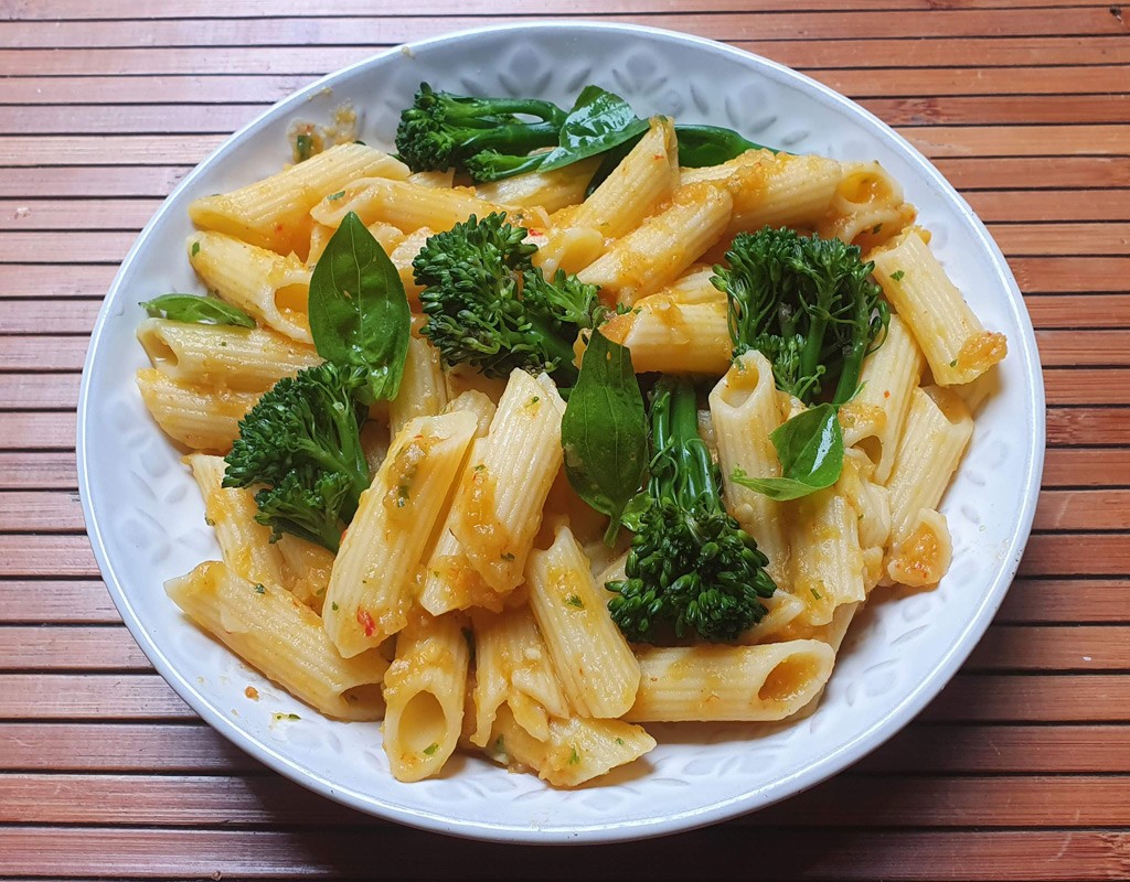 Pasta with broccoli in roasted pepper, sweet potato and chickpea sauce