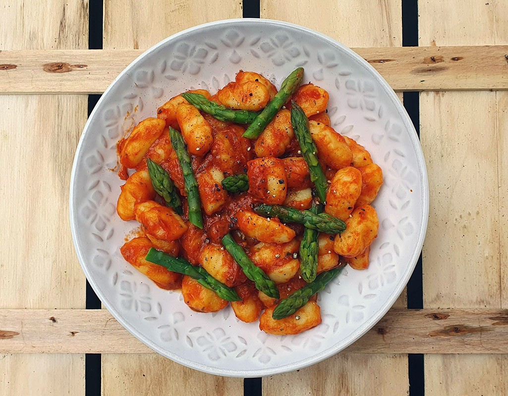 Gnocchi and asparagus in red pepper & tomato sauce