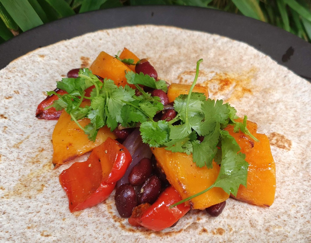 Tortilla with roasted squash and beans