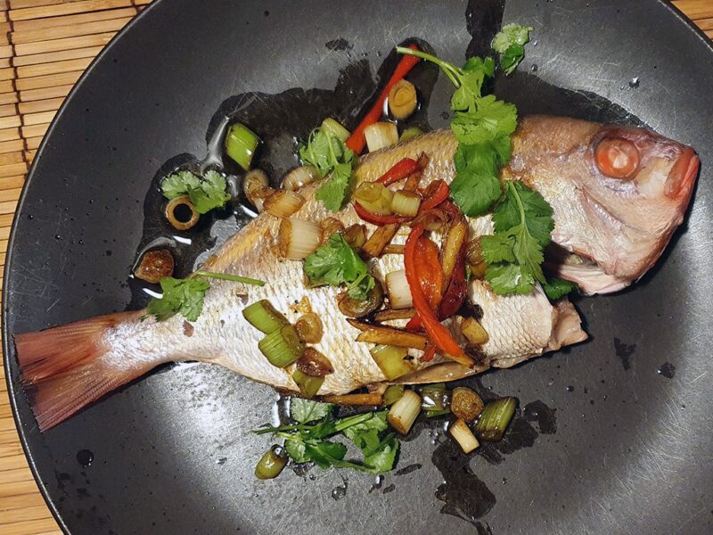 Chinese sizzling steamed fish