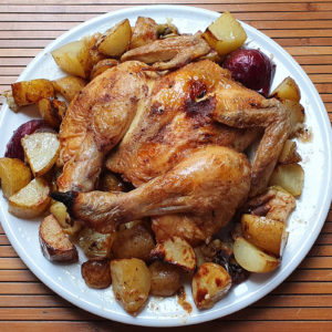 Cinnamon rubbed butterflied chicken with potatoes