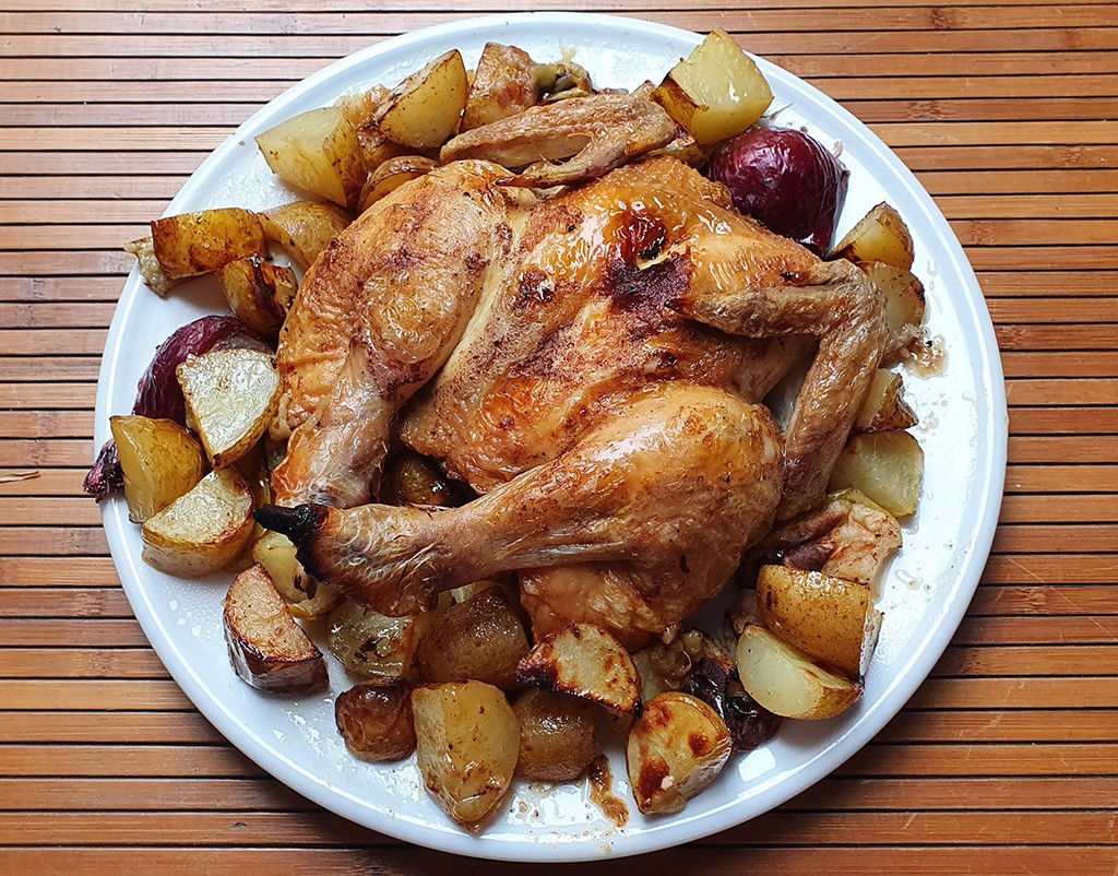 Cinnamon rubbed butterflied chicken with potatoes