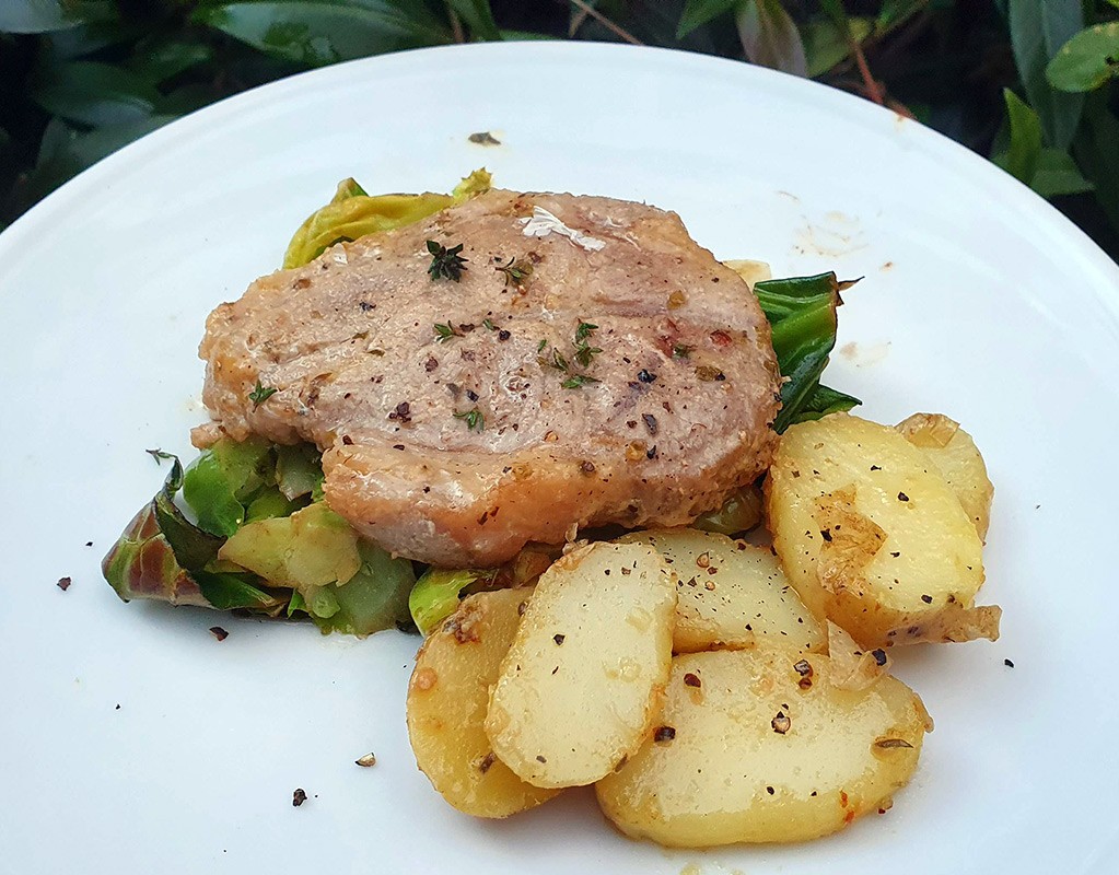 Mustard and garlic pork fillet with potatoes and cabbage