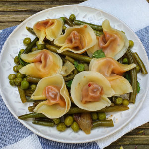 Tortellini with sauteed green peas and beans