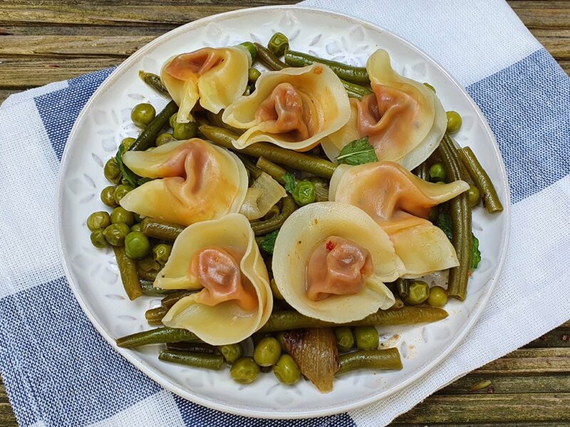 Tortellini with sauteed green peas and beans