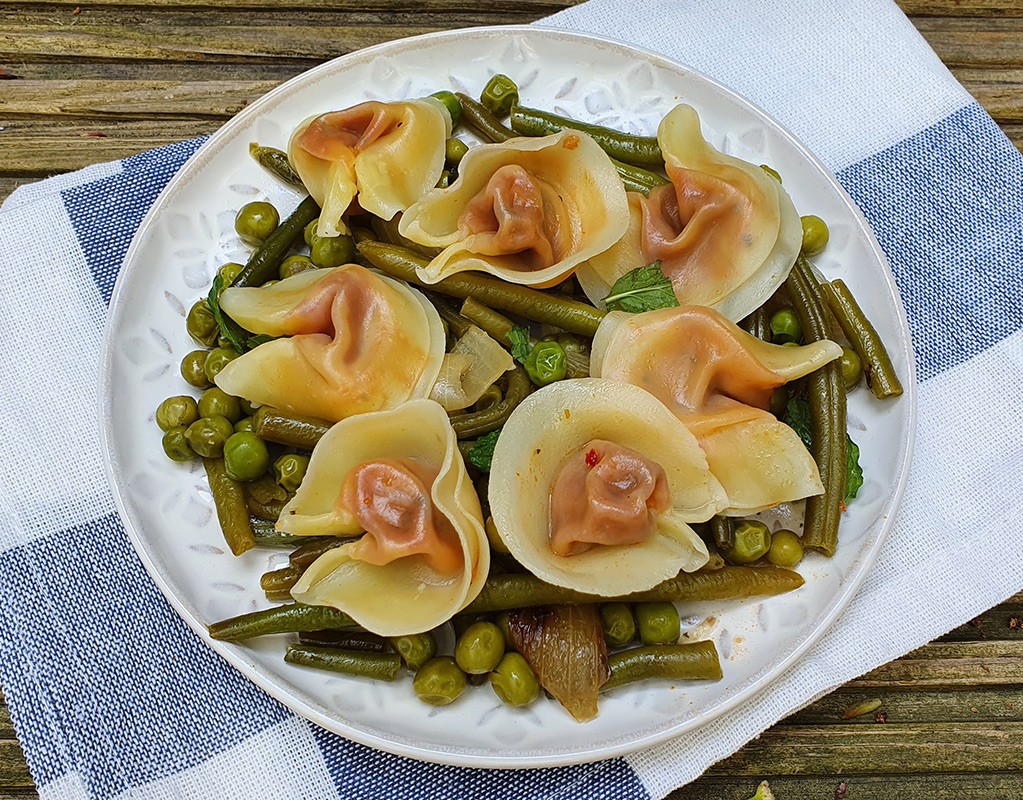 Tortellini with sauteed green peas and beans