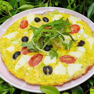 Courgette frittata with cheese and tomato