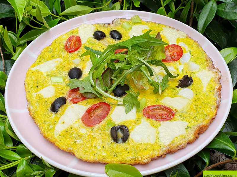 Courgette frittata with cheese and tomato