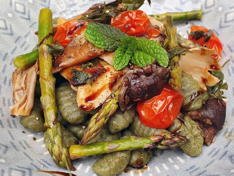 Gnocchi with balsamic mushrooms, tomatoes and asparagus