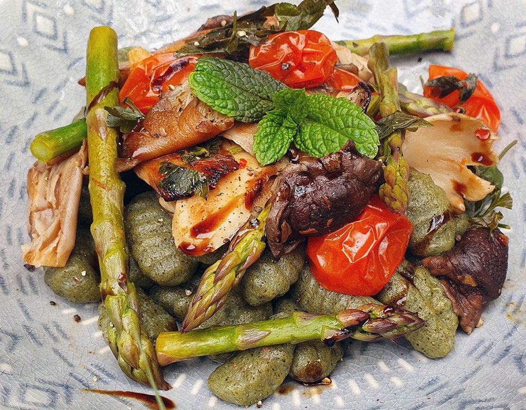 Gnocchi with balsamic mushrooms, tomatoes and asparagus