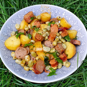 New potatoes with sausages and broad beans