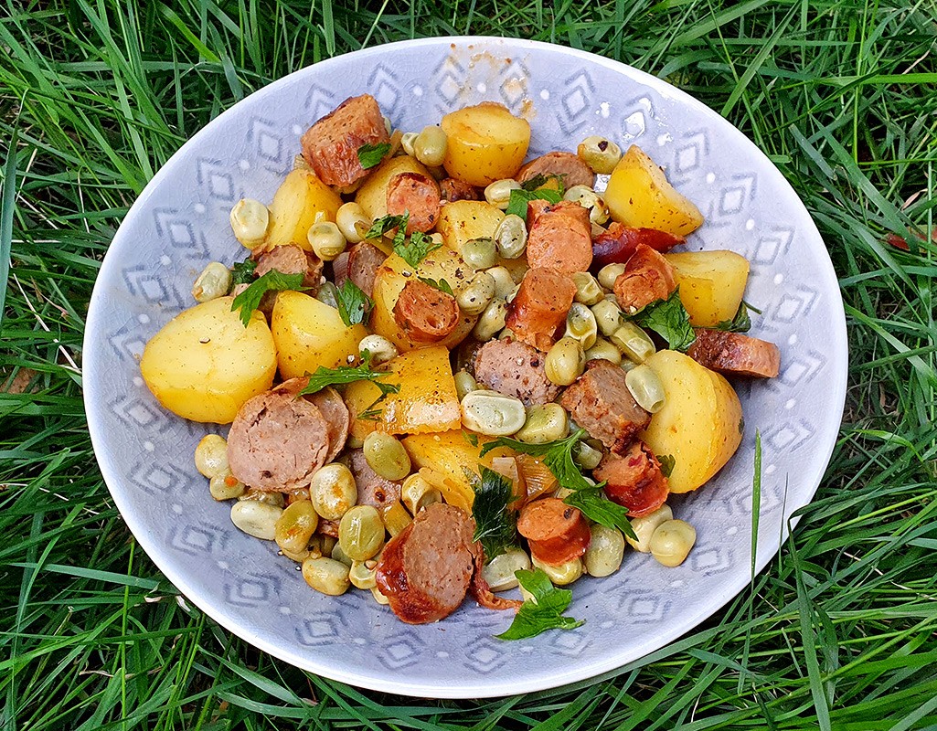 New potatoes with sausages and broad beans