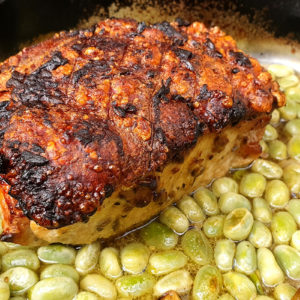 Fennel and mustard roasted pork with broad beans