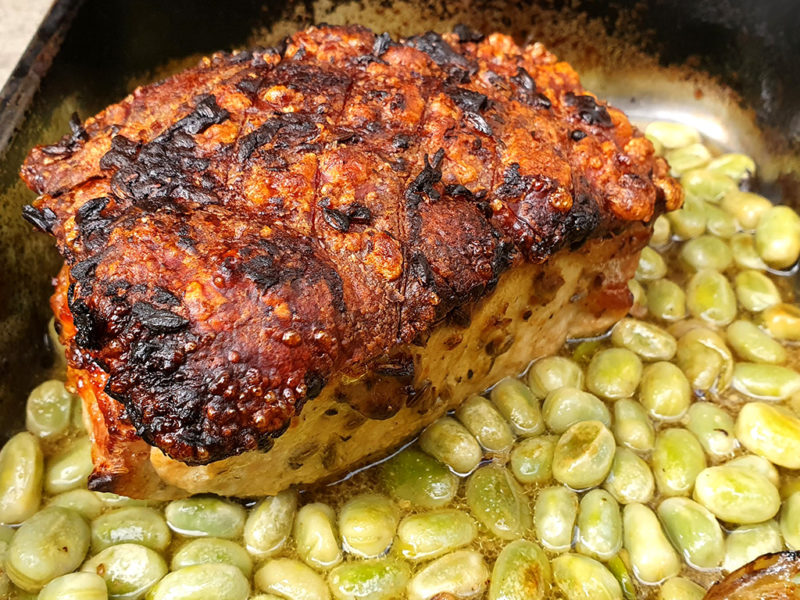 Fennel and mustard roasted pork with broad beans