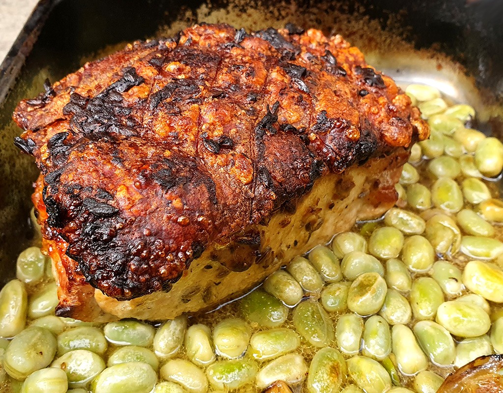 Fennel and mustard roasted pork with broad beans