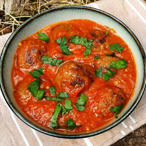 Meatballs in barbecued aubergine and tomato sauce