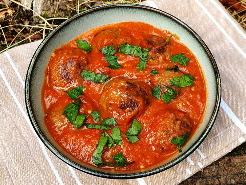 Meatballs in barbecued aubergine and tomato sauce