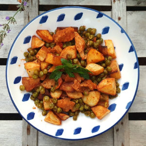 Pork and potato fry with peas