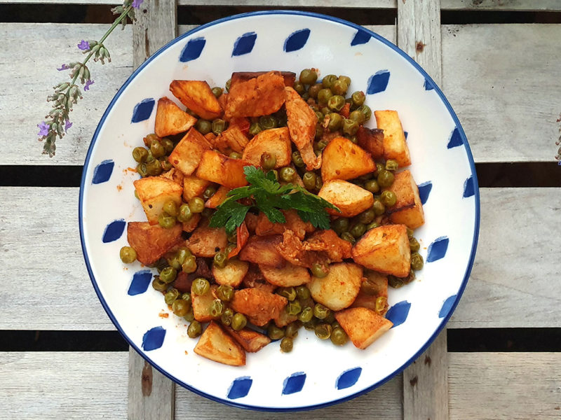 Pork and potato fry with peas