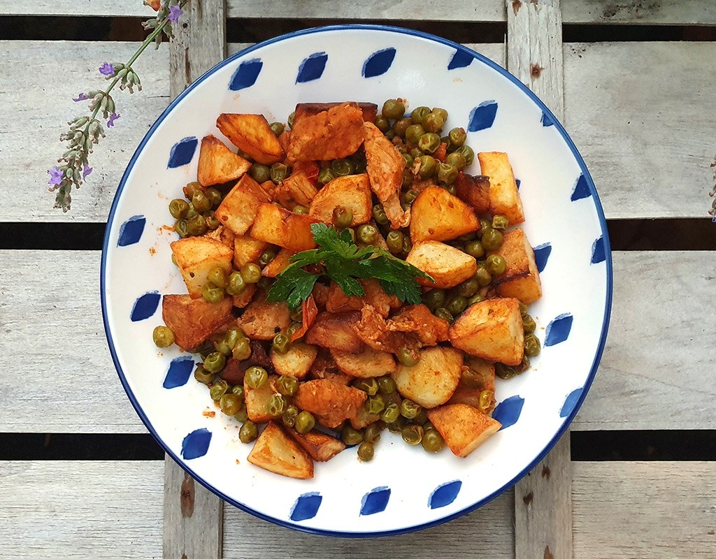 Pork and potato fry with peas